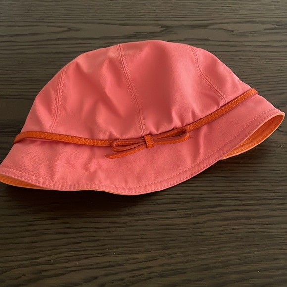 Coach bucket hat. Pink/peach canvas with leather bow trim. - Picture 2 of 3